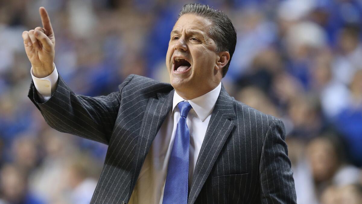 Kentucky Coach John Calipari instructs his players during a game against Texas on Friday.
