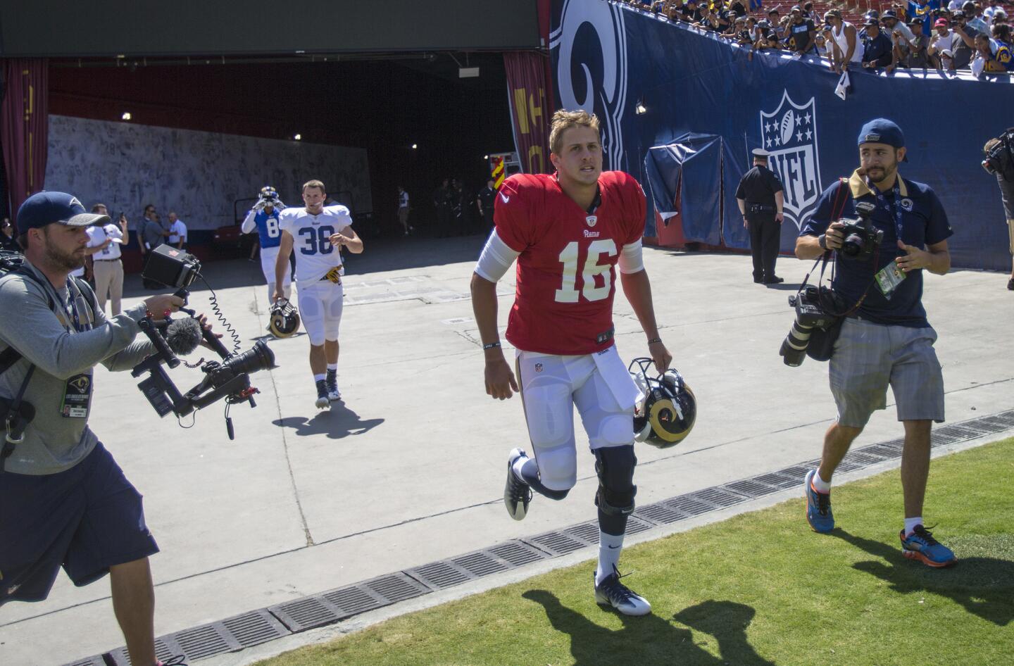 LOS ANGELES, CA - AUGUST 6, 2016: Rams rookie quarterback Jared Goff (#16) enters the L.A. Coliseum of the first time as a Ram before a team scrimmage on August 6, 2016 in Los Angeles, California.(Gina Ferazzi / Los Angeles Times)