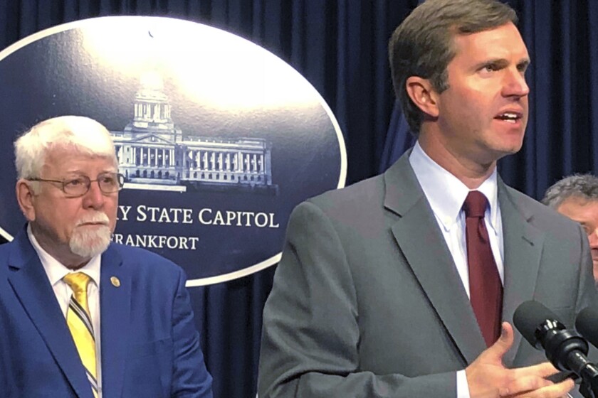 Kentucky Gov. Andy Beshear, right, speaks during a news conference, Feb. 18, 2020, in Frankfort, Ky. as Republican state Rep. Danny Bentley listens. Gov. Beshear said Thursday, March 3, 2022 there is no place for antisemitism in the state after the Republican state lawmaker expounded on the sexual habits of Jewish women during a legislative debate, a monologue several Jewish groups characterized as “bizarre." Rep. Danny Bentley commented on the Holocaust and his perception of the sexual habits of Jewish women. He spoke during a long House debate on legislation to regulate the dispensing of abortion pills. (AP Photo/Bruce Schreiner, file)