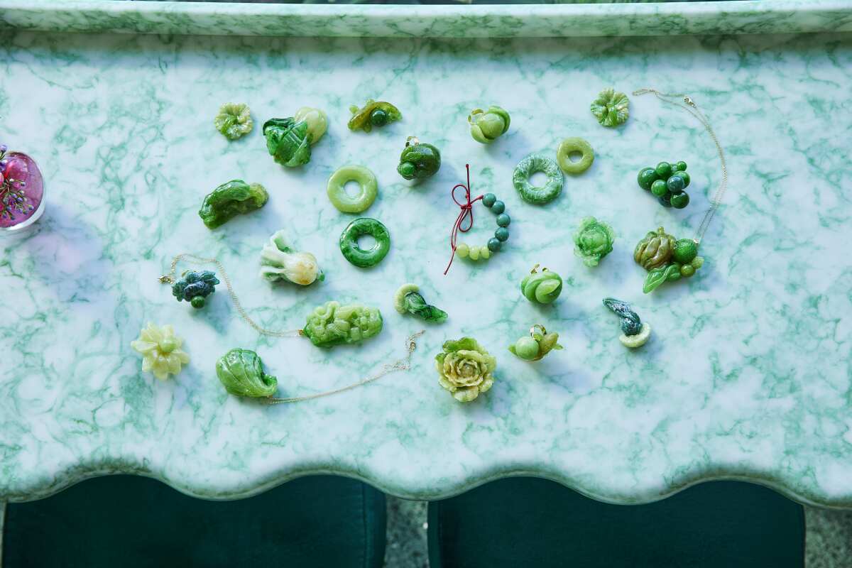 An overhead photo of an array of necklaces, bracelets and rings from the Chifa x Sweet Saba green jade collection.