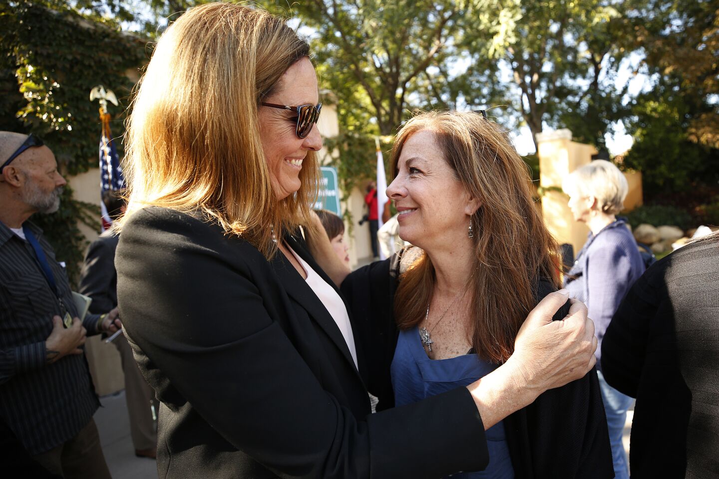 Assemblywoman Jacqui Irwin hugs mother of a victim