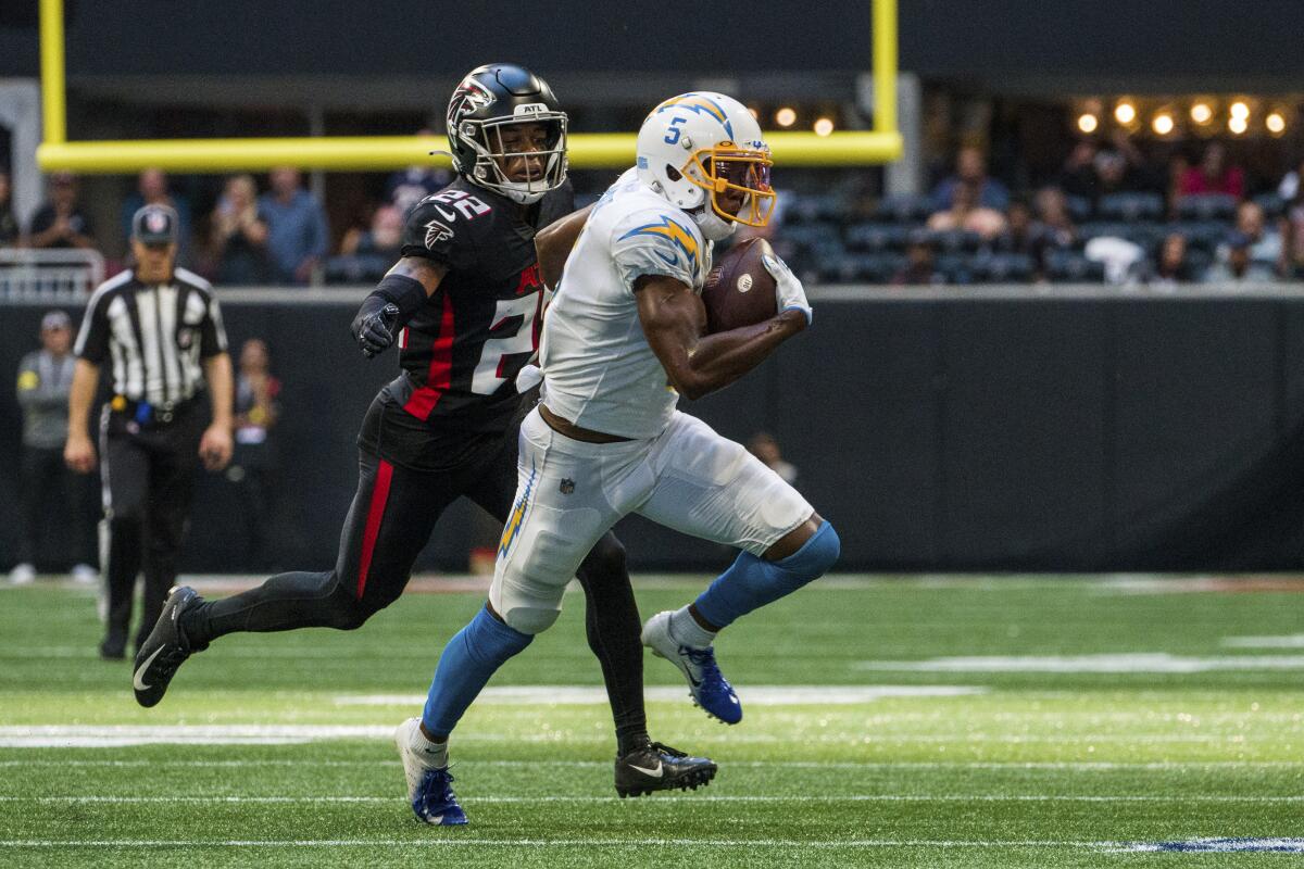 Chargers receiver Joshua Palmer (5) runs the ball past  Falcons cornerback Cornell Armstrong.