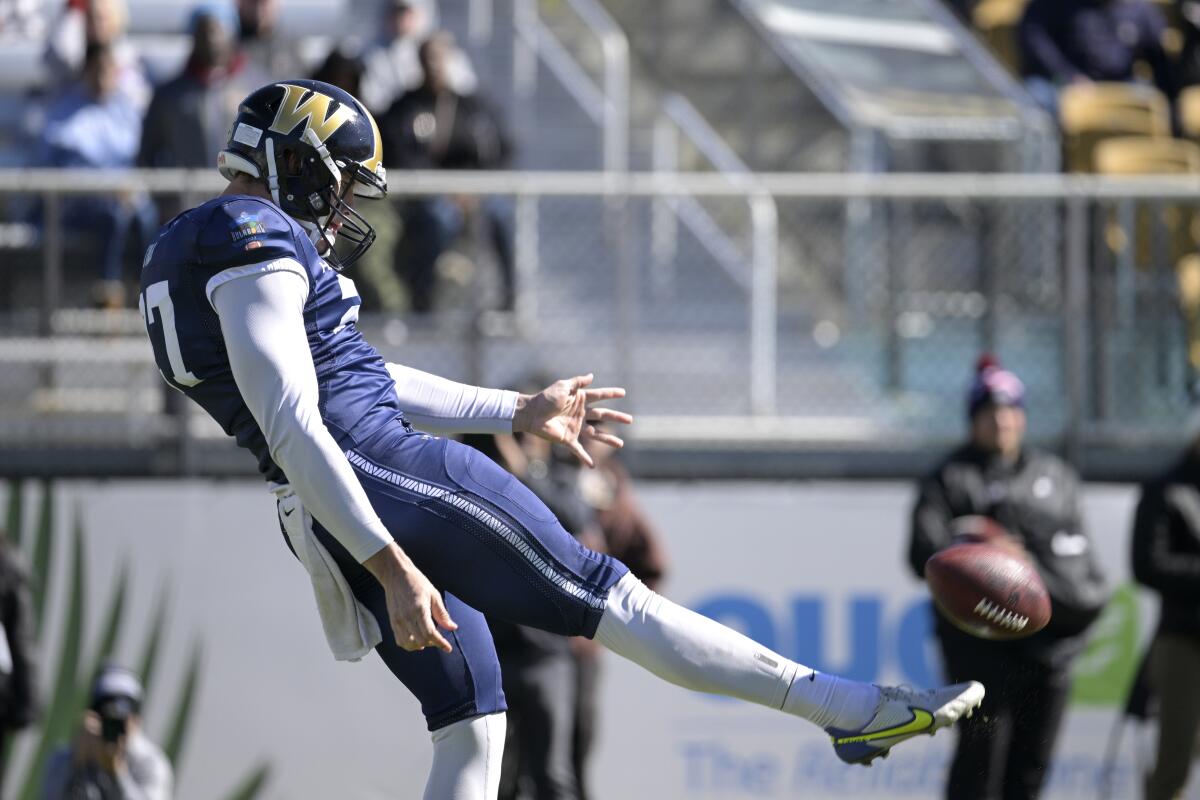 Punter Ethan Evans (27) of Wingate kicks during the Hula Bowl. The Rams entered the draft without any kickers.