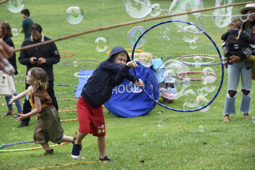 Kids play with bubbles at last year's EcoFest Encinitas.