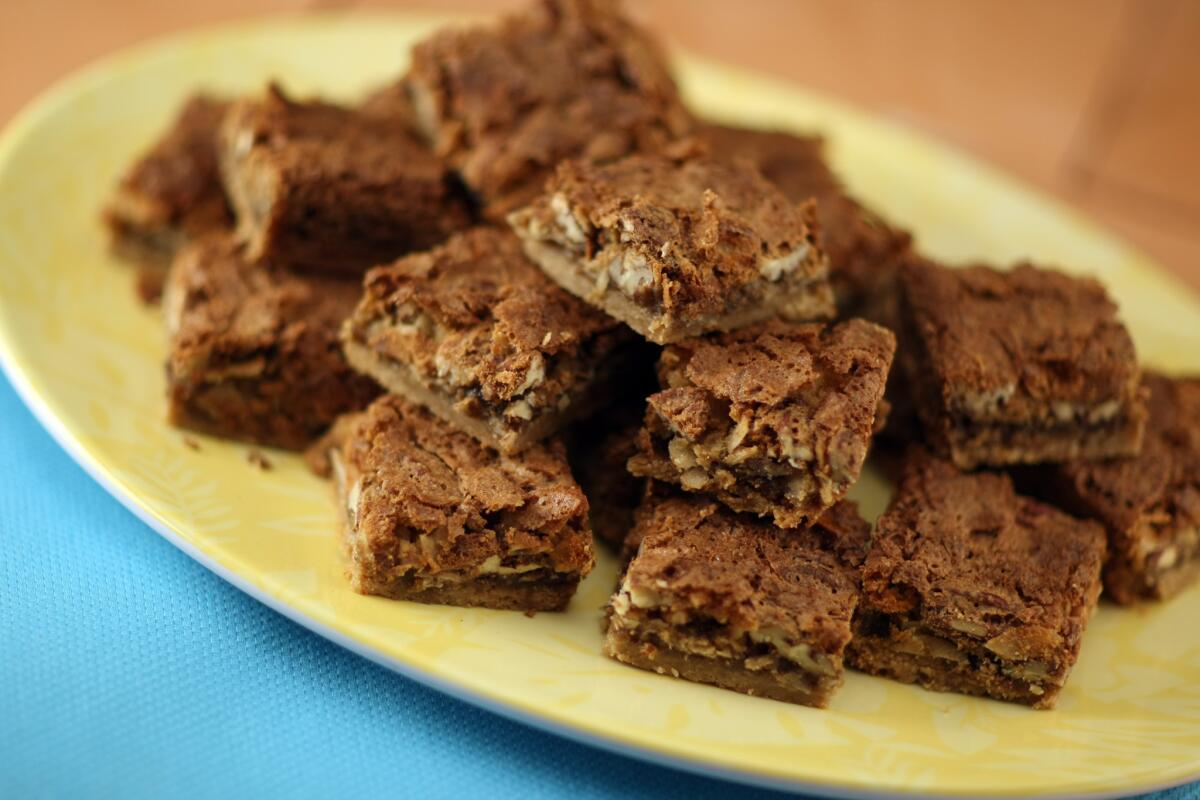 Combine pecans and coconut in a sweet topping, then bake it over a rich shortbread-like crust.