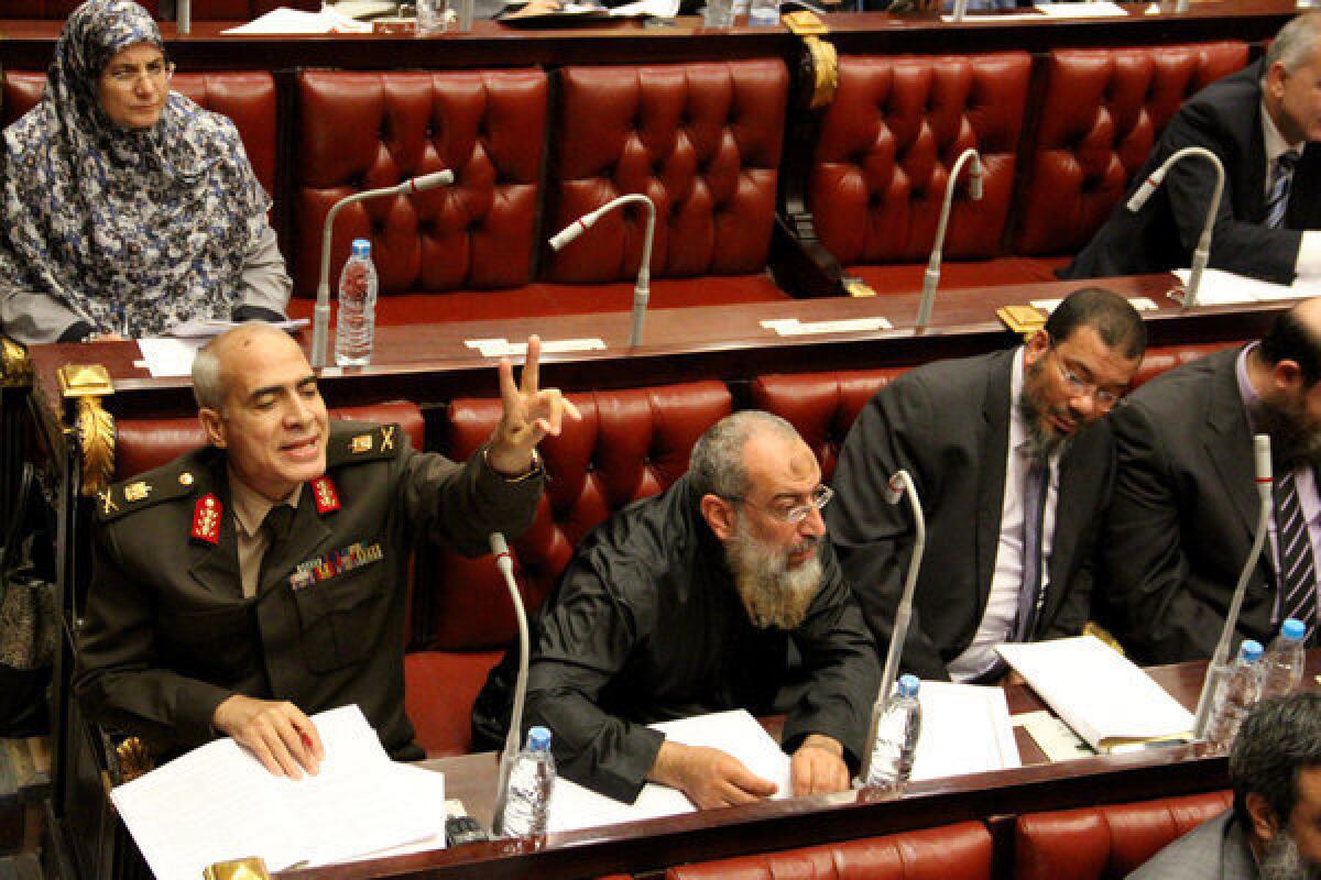 Members of the constitutional assembly attend a session in Cairo to vote on a draft of a new Egyptian constitution.