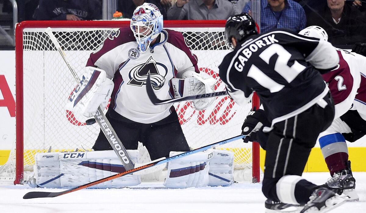 Kings right wing Marian Gaborik, right, shoots and scores on Colorado Avalanche goalie Reto Berra during the first period on Sunday.