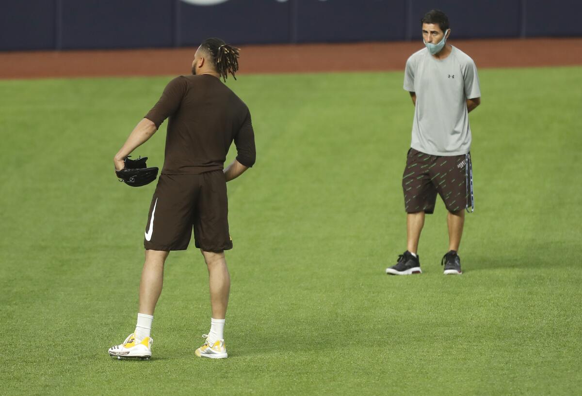 Padres General Manager A.J. Preller watched as Dinelson Lamet throws during a workout at Globe Life Field last week.