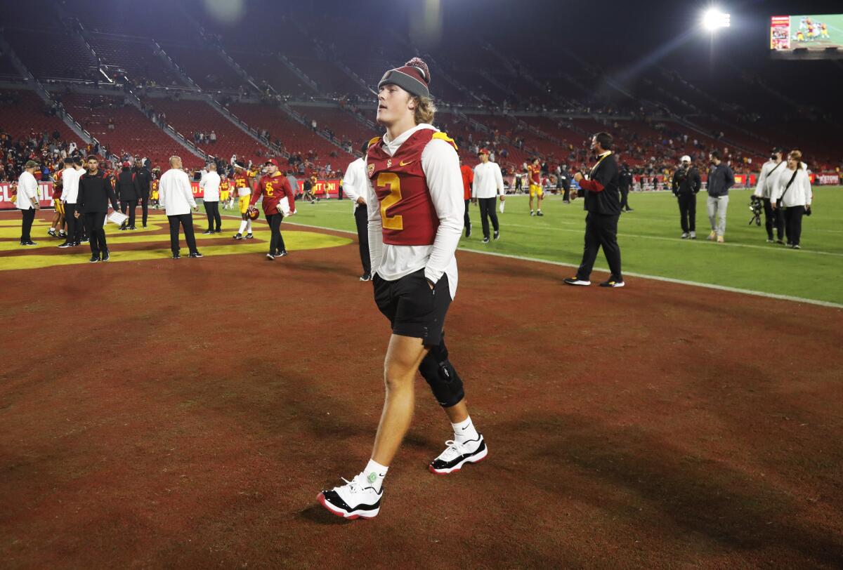 Injured USC quarterback Jaxson Dart leaves the field.