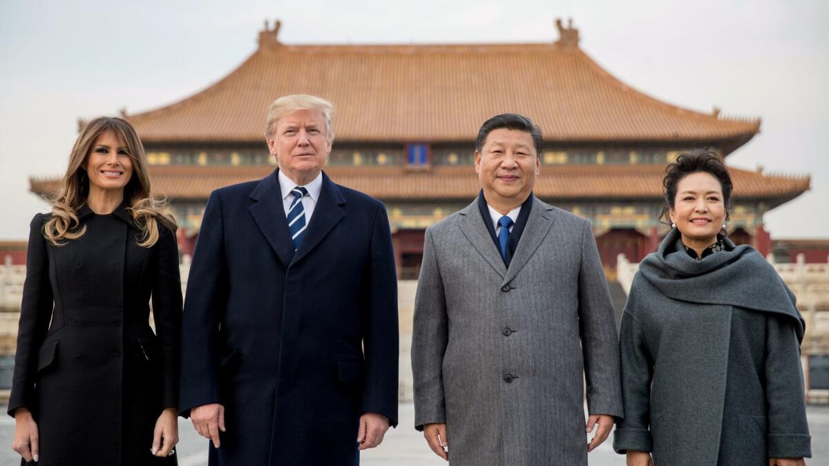 President Trump and First Lady Melania Trump tour the Forbidden City in Beijing with Chinese President Xi Jinping and his wife, Peng Liyuan, on Nov. 8, 2017.