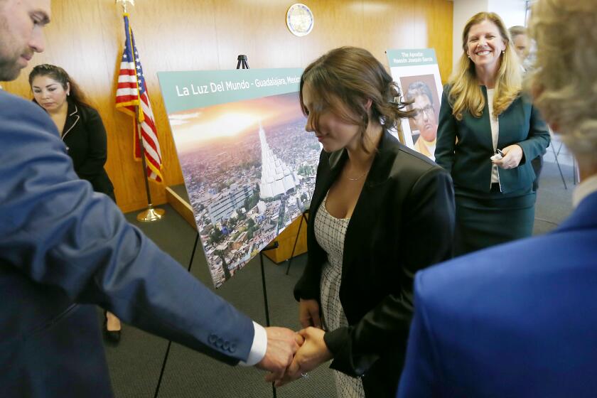 LOS ANGELES, CALIF. - FEB. 13, 2020. Sochil Martin, who said she is a former sex slave of La Luz Del Mundo leader Naason Joaquin Garcia, finishes up a press conference in downtown Los Angeles on Thursday, Feb. 13, 2020. Martin told reporters that she was groomed from a young age to provide sex to Garcia. She alleged that the human trafficking and sexual abuse of women and girls by top leaders of the church is ongoing. Garcia is in custody and facing trial on sex trafficking charges brought by the California attorney general. (Luis Sinco/Los Angeles Times)