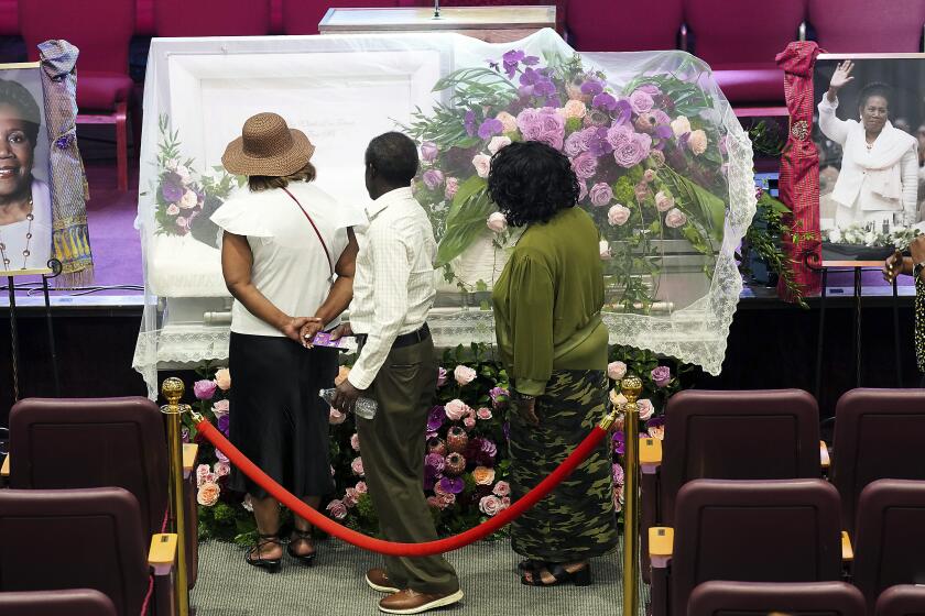 Attendees of the viewing and remembrance for the late Congresswoman Sheila Jackson Lee pay their respects at God's Grace Community Church on Tuesday, July 30, 2024 in Houston. (Elizabeth Conley/Houston Chronicle via AP)