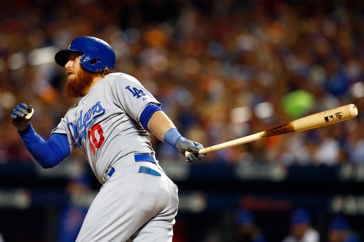 Dodgers third baseman Justin Turner watches his two-run double take flight in the third inning of Game 4 against the Mets.