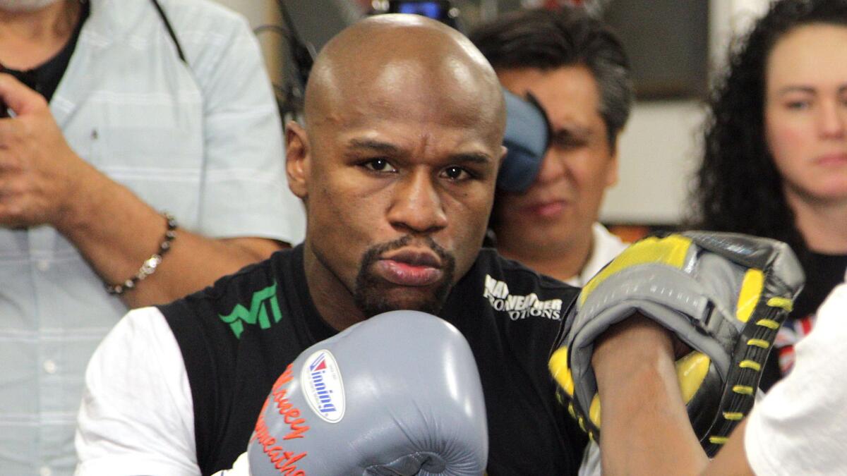 Welterweight champion Floyd Mayweather Jr. works out at Mayweather Boxing Club in Las Vegas on April 14 as he trains for his May 2 title fight against Manny Pacquiao.