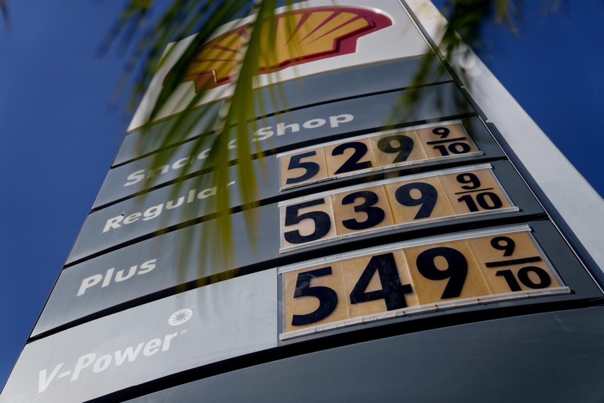 Prices are listed at a Shell gas station. 