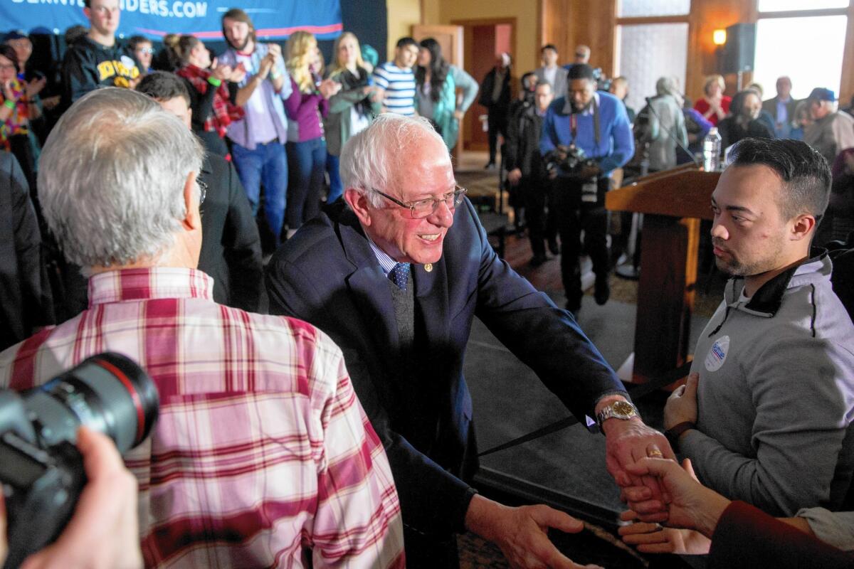 Bernie Sanders greets members of the crowd at a campaign event Tuesday in Carroll, Iowa.