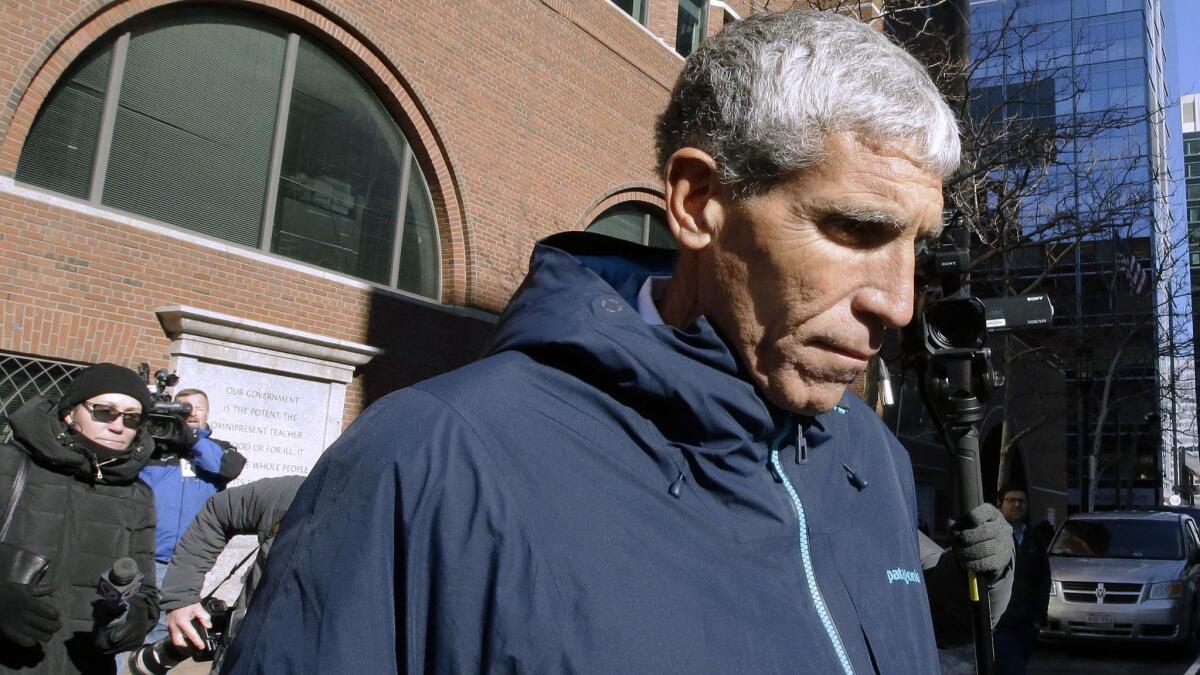 William "Rick" Singer, founder of the Edge College & Career Network, leaves federal court in Boston this week after pleading guilty to charges in a nationwide college admissions bribery scandal.