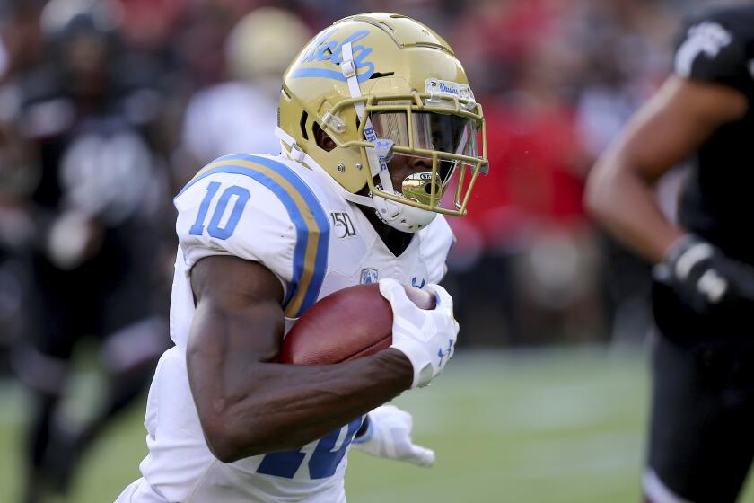 UCLA running back Demetric Felton during an NCAA football game on Thursday, Aug. 29, 2019 in Cincinnati. (AP Photo/Tony Tribble)