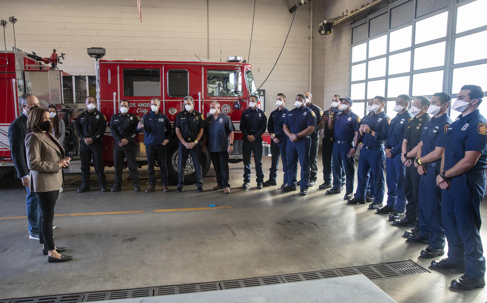 Vice President Kamala Harris and Second Gentleman Doug Emhoff greet firefighters at Los Angeles Fire Department Station 94.