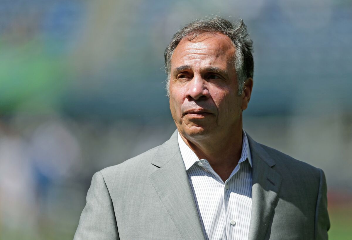 Galaxy Coach Bruce Arena walks on the pitch following an MLS game against the Sounders in Seattle on July 31.