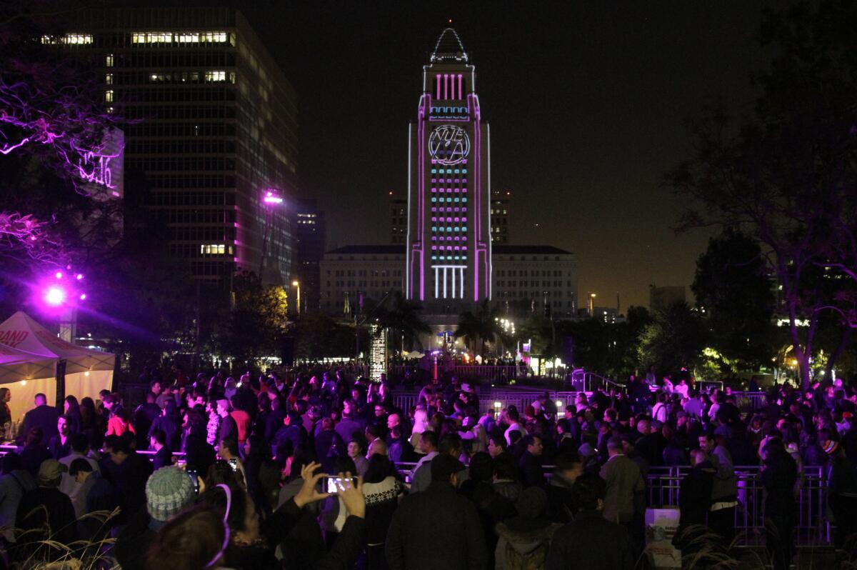 Revelers enjoy 2013's New Year's Eve festivities in downtown's Grand Park, where Live Nation is in discussions to stage a multi-day music festival.
