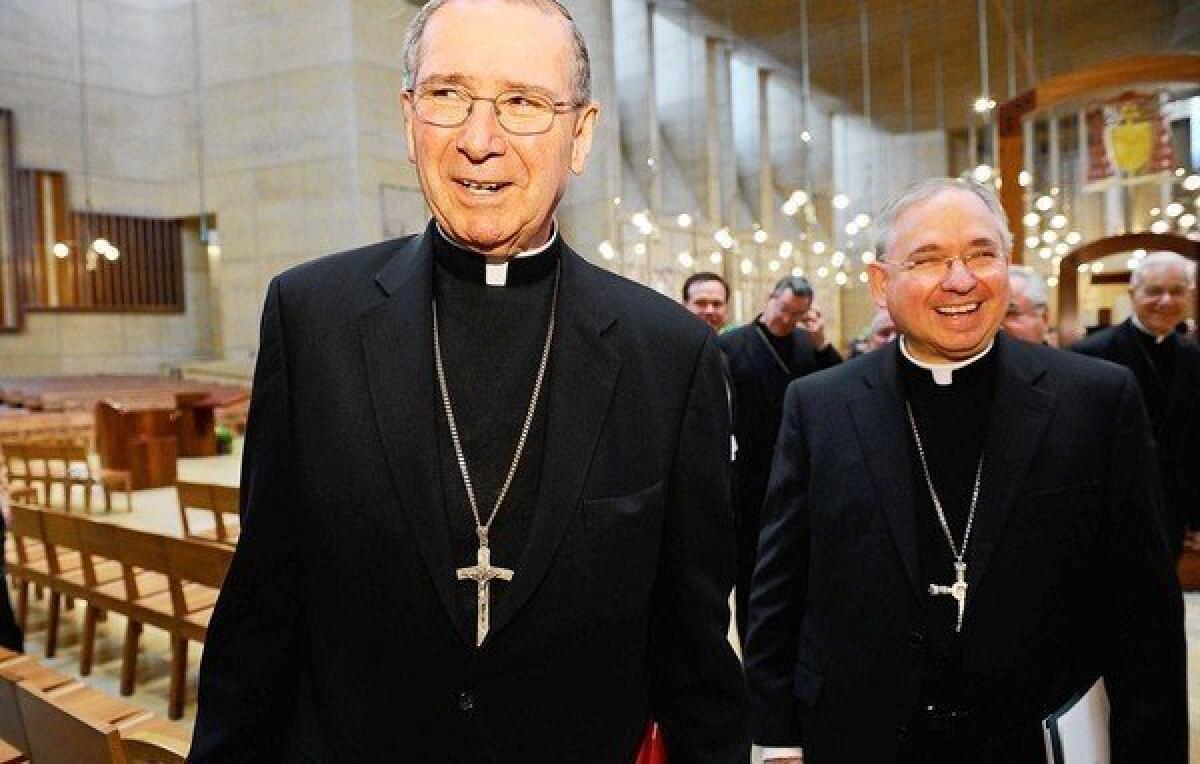 Cardinal Roger Mahony, left, with his successor, Jose Gomez, after a news conference at the Cathedral of Our Lady of the Angels on April 6, 2010.