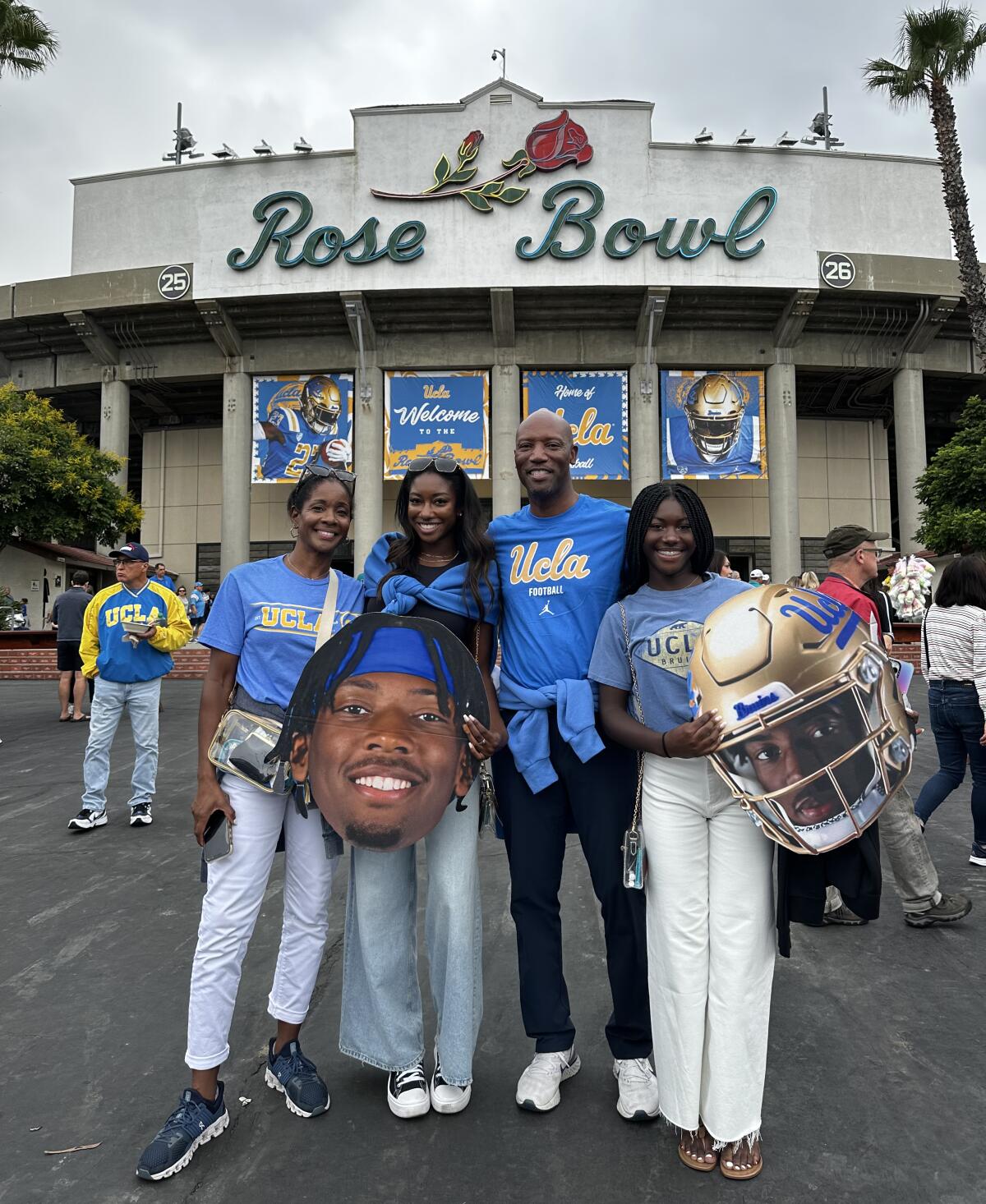 UCLA wide receiver J.Michael Sturdivant's family stands in front of the Rose Bowl before a game.