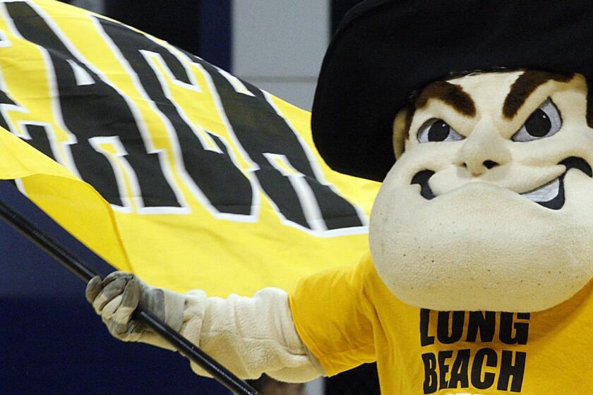 Sinco, Luis  B581710991Z.1 LONG BEACH, CALIF. NOV. 22, 2011. Cal State Long Beach mascot Prospector Pete fires up the crowd before Tuesday night's game, Nov. 22, 2011, against Boise State at The Pyramid in Long Beach.