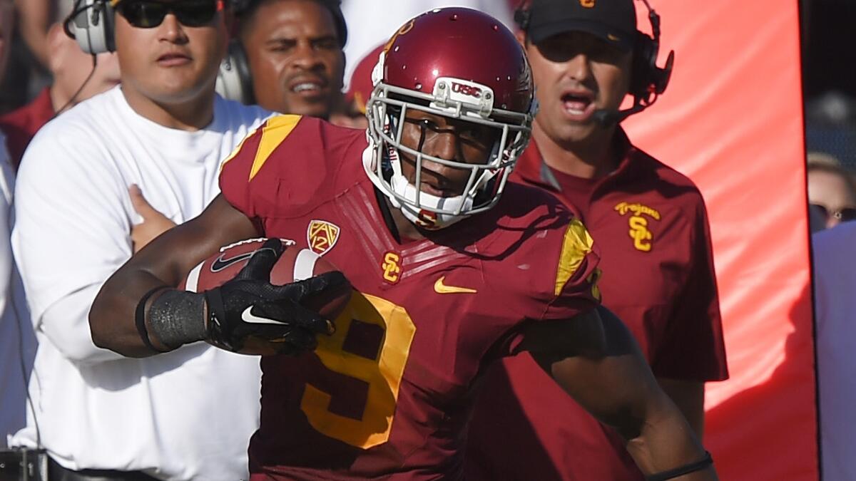 USC wide receiver Juju Smith runs after catching a pass in the Trojans' season opener against Fresno State at the Coliseum on Aug. 30, 2014.