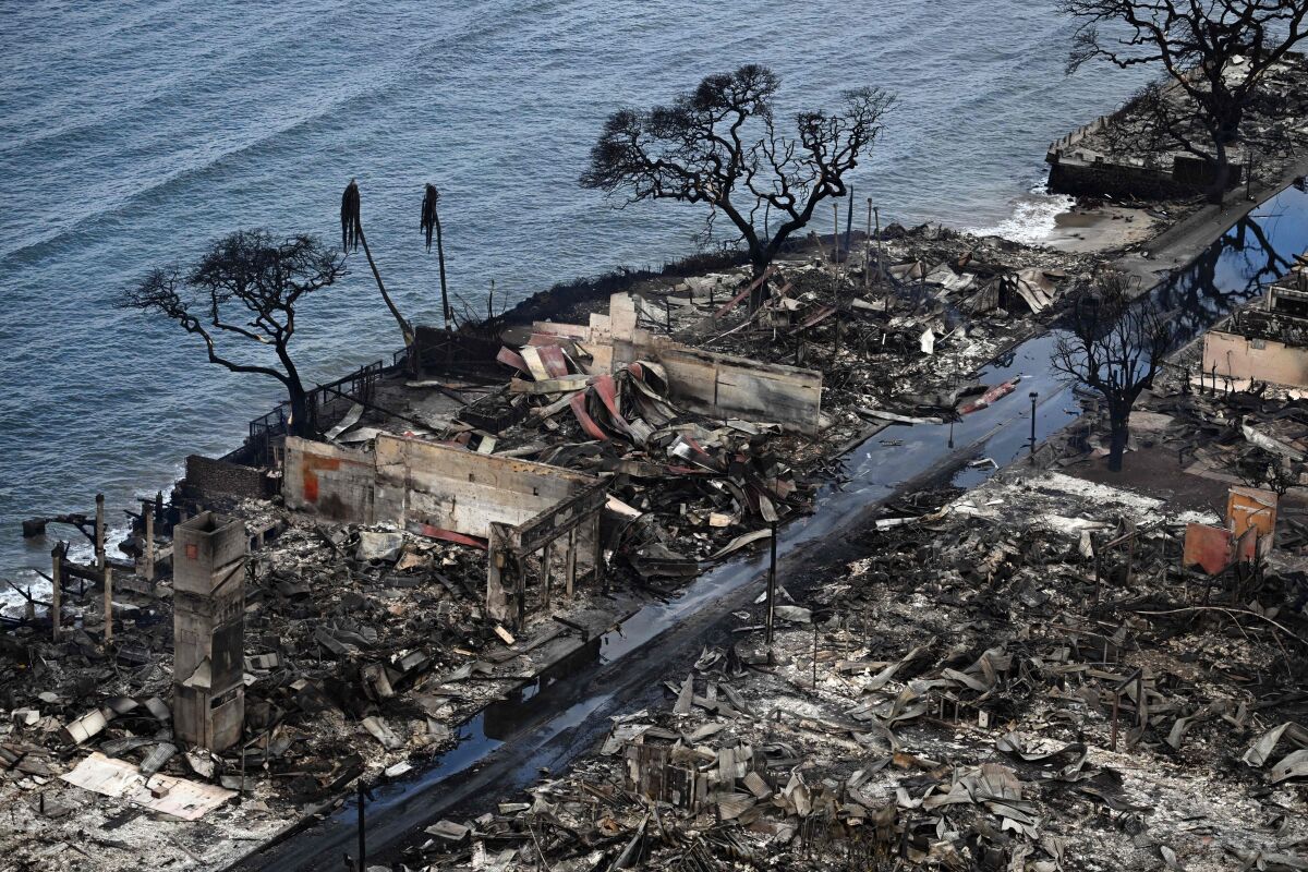 An aerial image taken Thursday shows burned-out buildings next to the ocean in Lahaina, Hawaii.