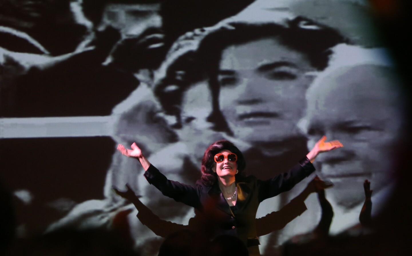 Controversial performance artist Karen Finley acknowledges the cheers of the audience in her performance of the one-woman show "The Jackie Look" at the Broad museum on Nov. 20, 2015. Finley takes on the persona of the iconic former first lady to address how we look at trauma