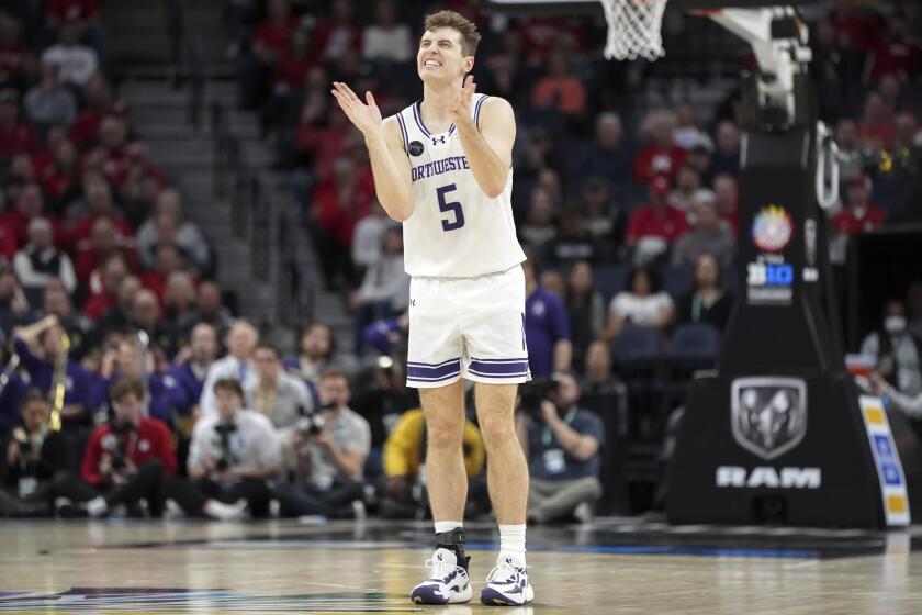 Northwestern guard Ryan Langborg (5) reacts after missing a shot during the first half of an NCAA college basketball game against Wisconsin in the quarterfinal round of the Big Ten Conference tournament, Friday, March 15, 2024, in Minneapolis. (AP Photo/Abbie Parr)