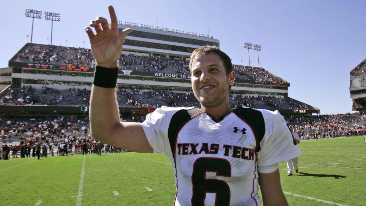Former Texas Tech quarterback Graham Harrell gestures as he walks off the field after a game against Texas A&M on Oct. 18, 2008, in College Station, Texas. Texas Tech won 43-25.