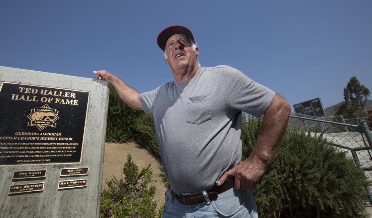 Ted Haller stands next to Glendora's Little League Hall of Fame, which is named after him. (Brian van der Brug / Los Angeles Times)