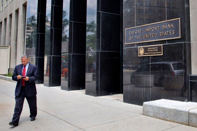 A man walks out of the Export-Import Bank of the U.S., Tuesday, July 28, 2015, in Washington. The federal Export-Import Bank expired June 30 when Congress failed to renew its charter. The bank is a small federal agency that helps U.S. companies sell their products overseas, by underwriting loans to foreign customers. Conservatives oppose it as corporate welfare and are pushing to keep it dead. But late Monday the Senate voted 64-29 to add legislation reviving the bank to a sweeping highway bill being considered on the floor. (AP Photo/Jacquelyn Martin)