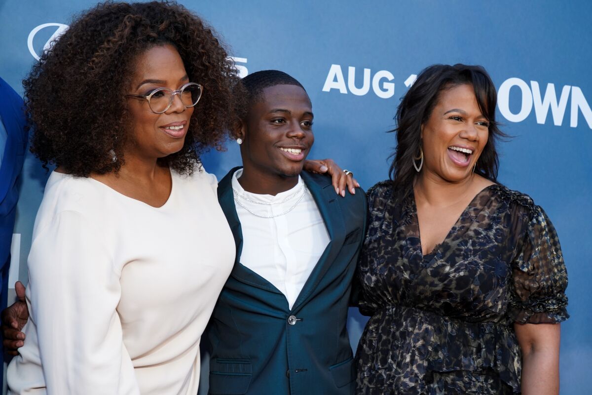 Oprah Winfrey, left, Akili McDowell and Tina Perry attend the premiere of OWN's "David Makes Man" in August 2019.