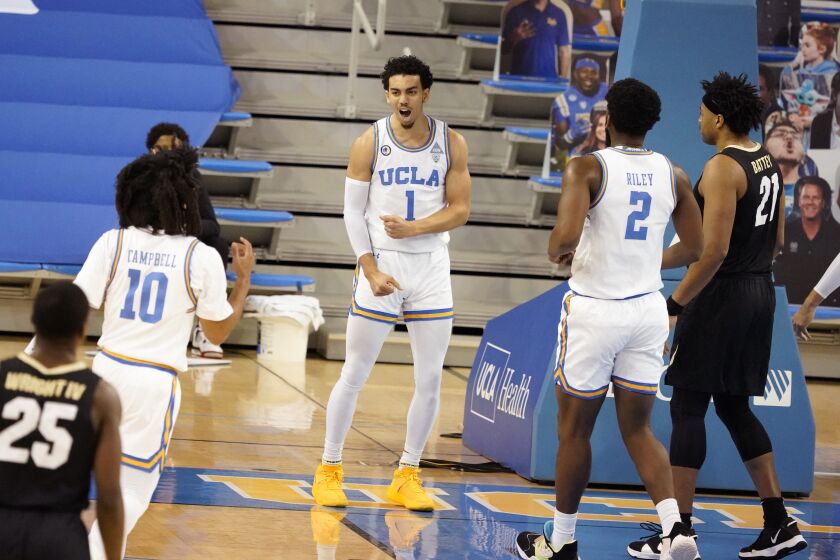 UCLA guard Jules Bernard (1) celebrates after scoring against Colorado during the first half Jan. 2, 2021, in Los Angeles.