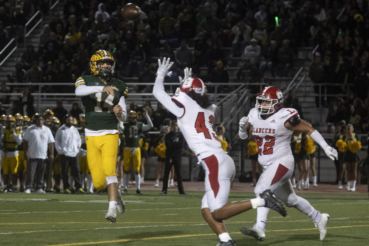 Edison's Parker Awad throws a short pass during the CIF Southern Section Division 1 playoffs in Huntington Beach on Friday.
