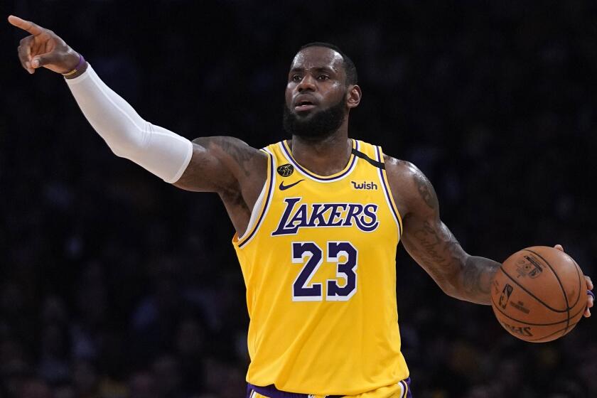 FILE - In this March 6, 2020, file photo, Los Angeles Lakers forward LeBron James gestures.
