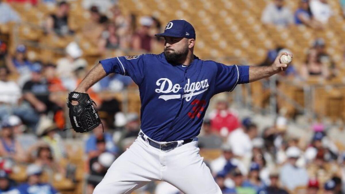 Dodgers reliever Adam Liberatore works against the San Francisco Giants during a spring training game on March 7.