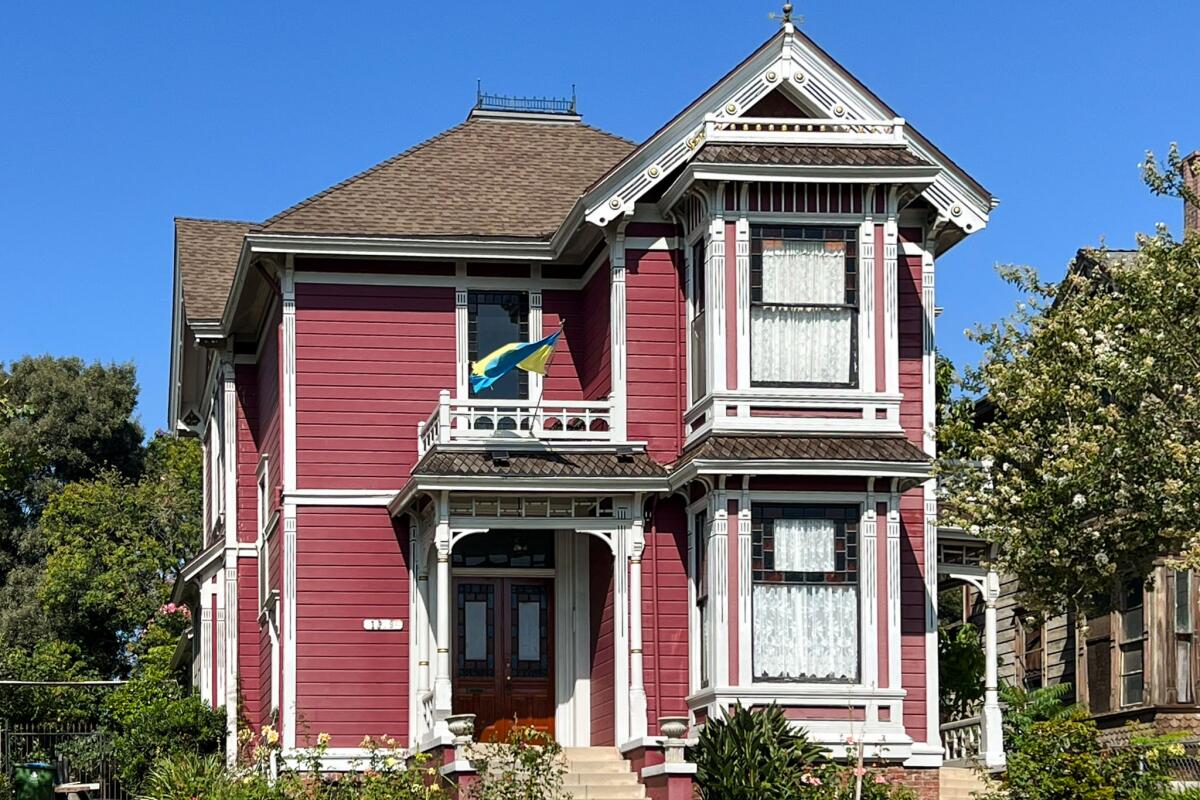 A Victorian-style house with detailed molding and lace curtains