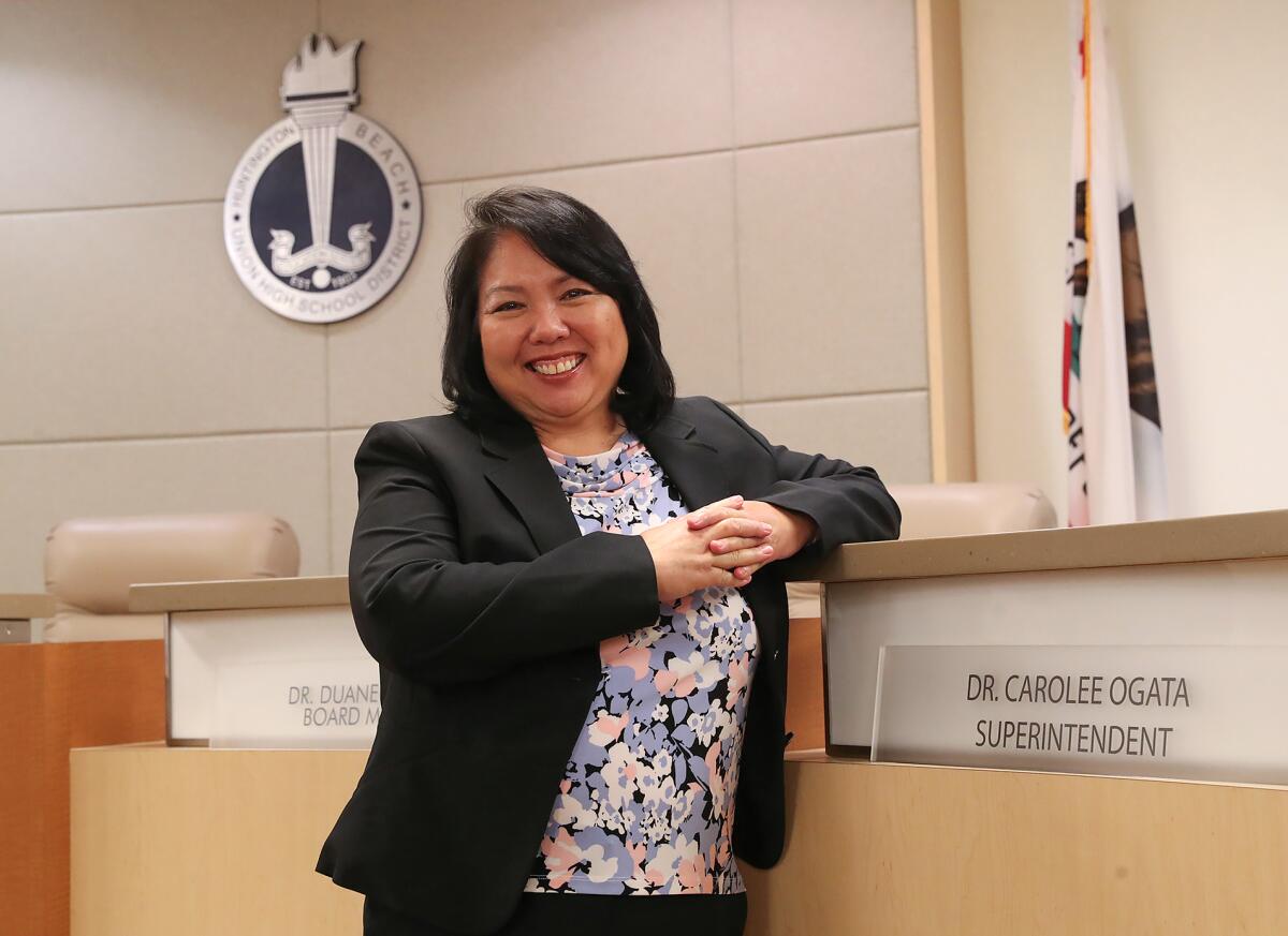 Carolee Ogata, the new superintendent of the Huntington Beach Union High School District, stands in the district office.