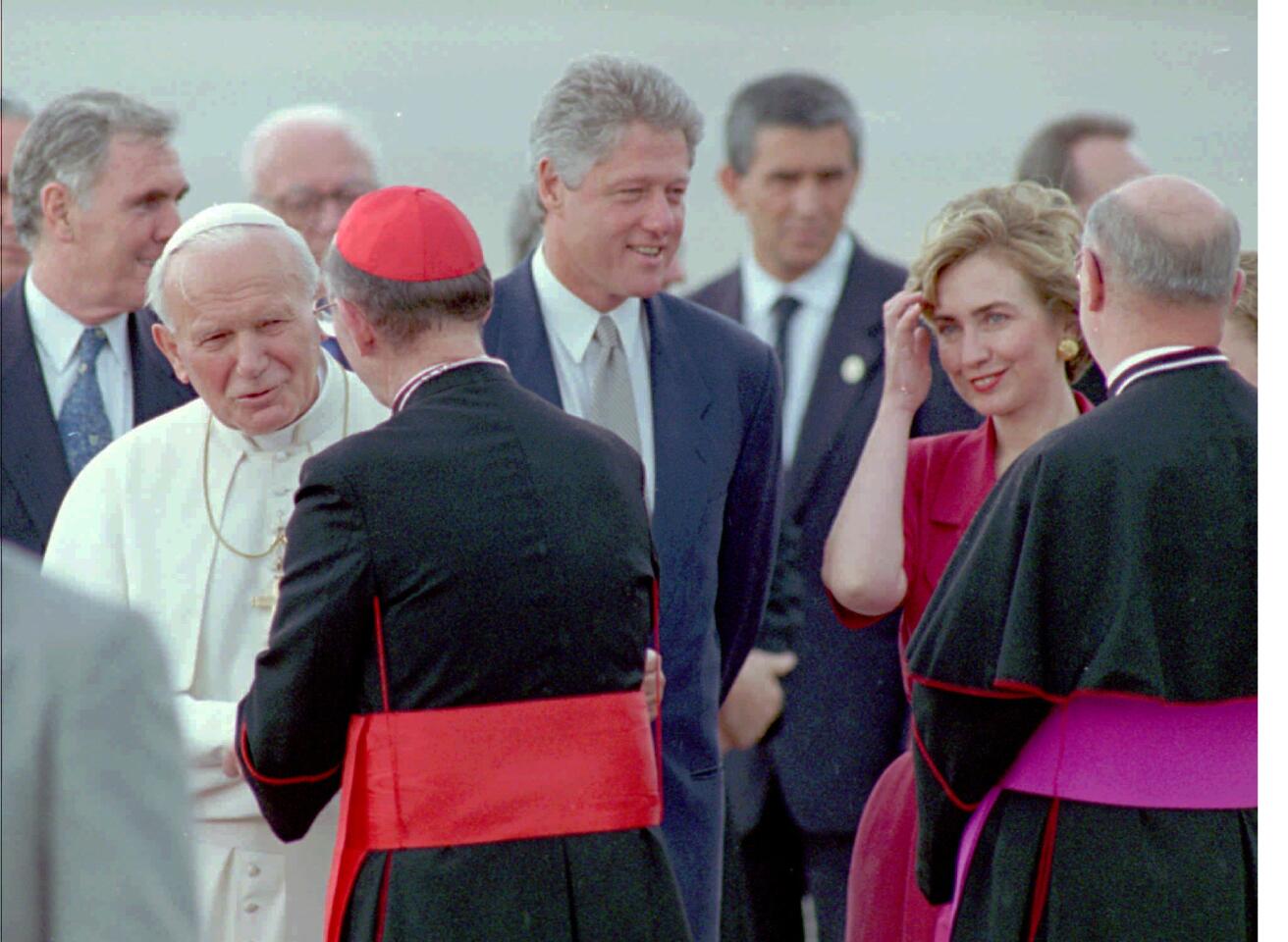 Pope John Paul II, President Clinton and First Lady Hillary Rodham Clinton greet cardinals and bishops in Denver after the pope's arrival.