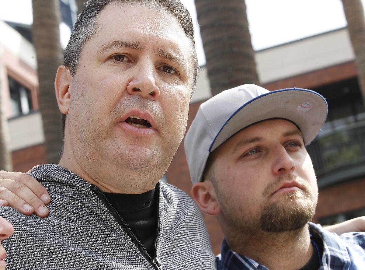 Robert Preece and Robert Preece Jr., father and brother of Jonathan Denver, make a public plea for witnesses outside AT&T Park.