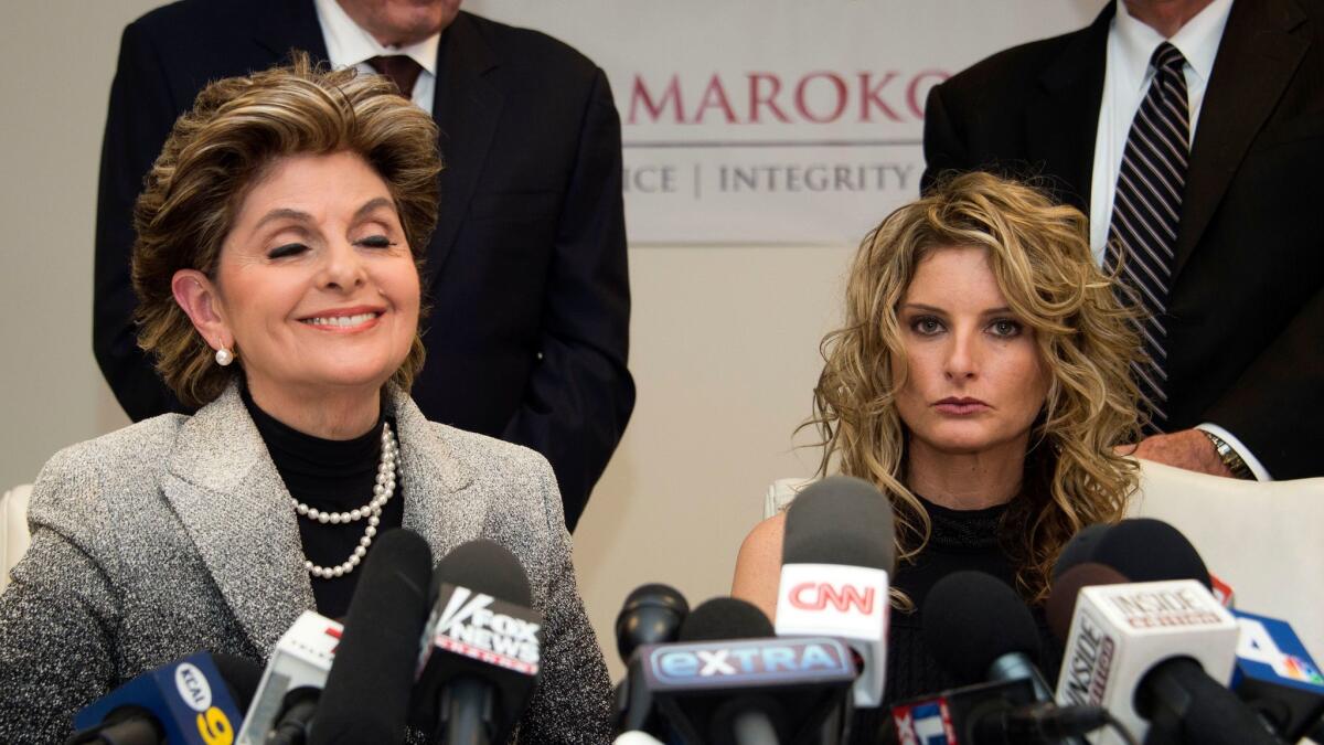 Attorney Gloria Allred, left, accompanies her client Summer Zervos at a news conference announcing Zervos' lawsuit against President-elect Donald Trump.