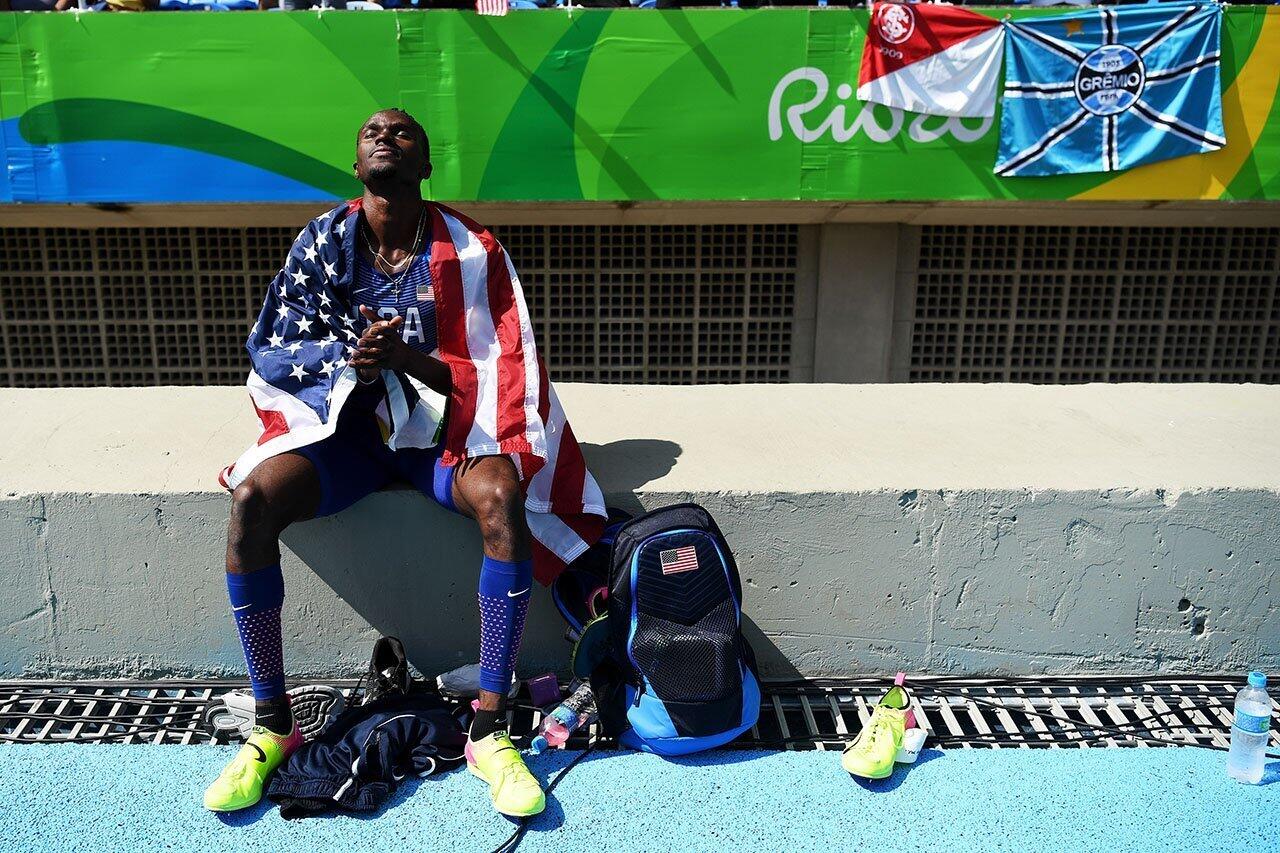 Will Claye of the United States has a moment to himself after winning the silver medal in the Men's Triple Jump Final on Day 11 of the Rio 2016 Olympic Games at the Olympic Stadium.