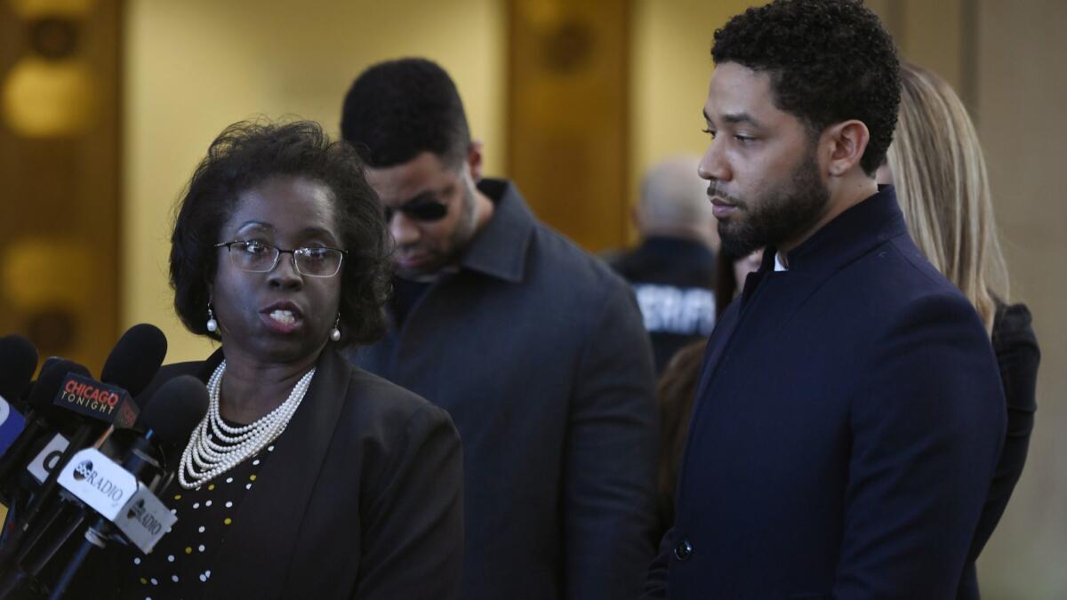 Actor Jussie Smollett, right, stands next to his attorney Patricia Brown Holmes during a news conference at Cook County Court after Smollett's charges were dropped on March 26.