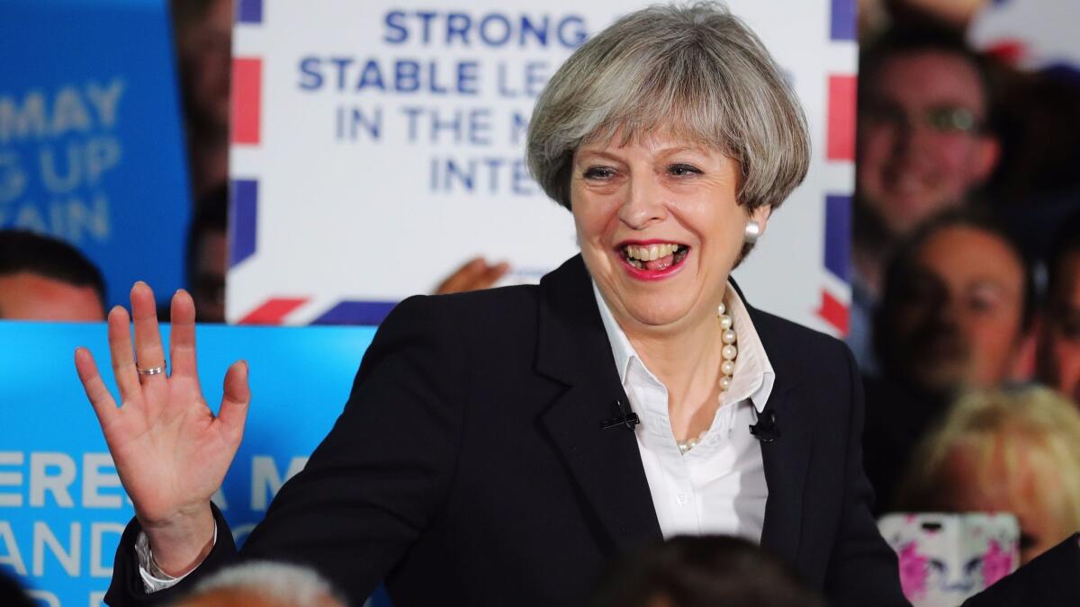 British Prime Minister Theresa May addresses supporters at the Provident Stadium in Bradford, England, as the election campaign resumes on June 5, 2017.