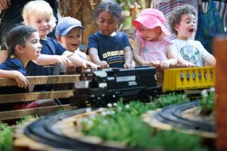 LA CANADA-CA-JULY 11, 2024: Children watch miniature trains at The Descanso Railroad, now open at Descanso Gardens in La Canada Flintridge on July 11, 2024. (Christina House / Los Angeles Times)