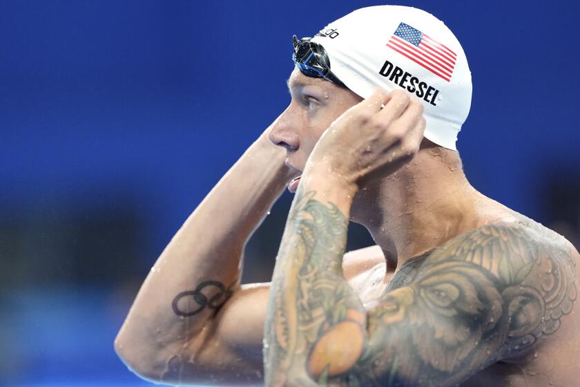 Caeleb Dressel, of United States, competes in their heat of the men's 50-meter freestyle.